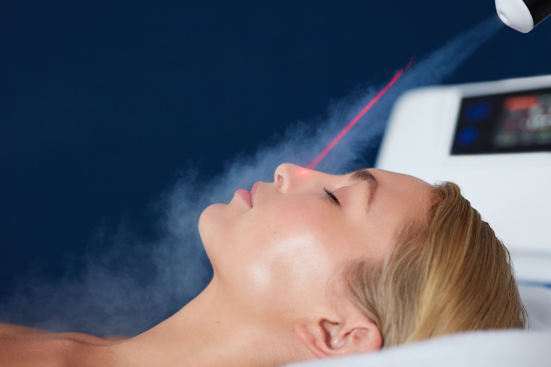 Localized cryotherapy on woman face